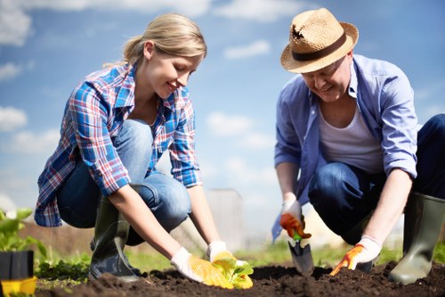 Gardening team preparing equipment at a site entrance